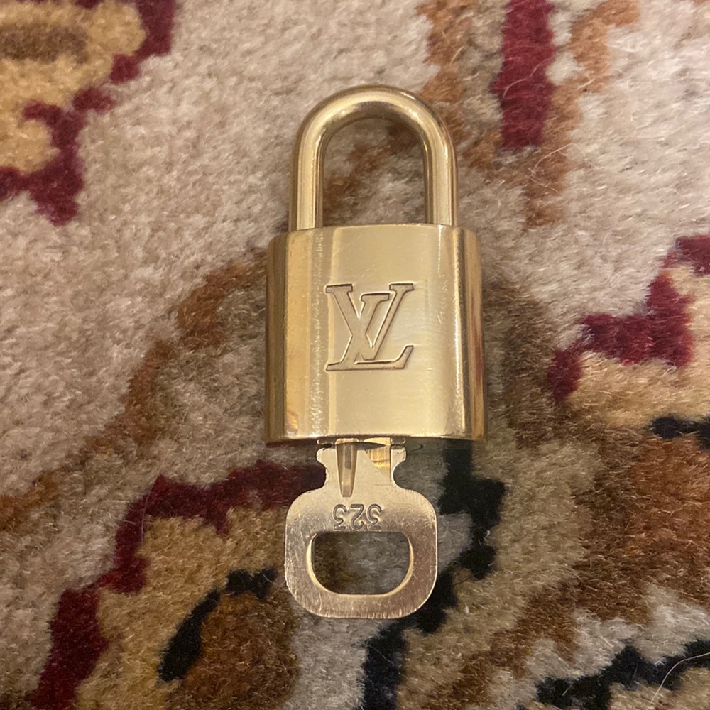 Authentic Louis Vuitton lock and key and 2 unbranded chains